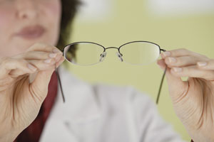 Doctor inspecting lenses